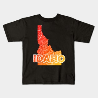 Colorful mandala art map of Idaho with text in red and orange Kids T-Shirt